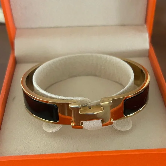 Hermès Clic H Enamel gold Bracelet in Black - Picture 1 of 5